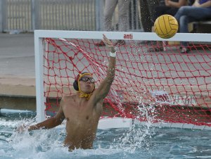 Lemoore goalkeeper Trey Pietsch goes for a block against Hanford West.